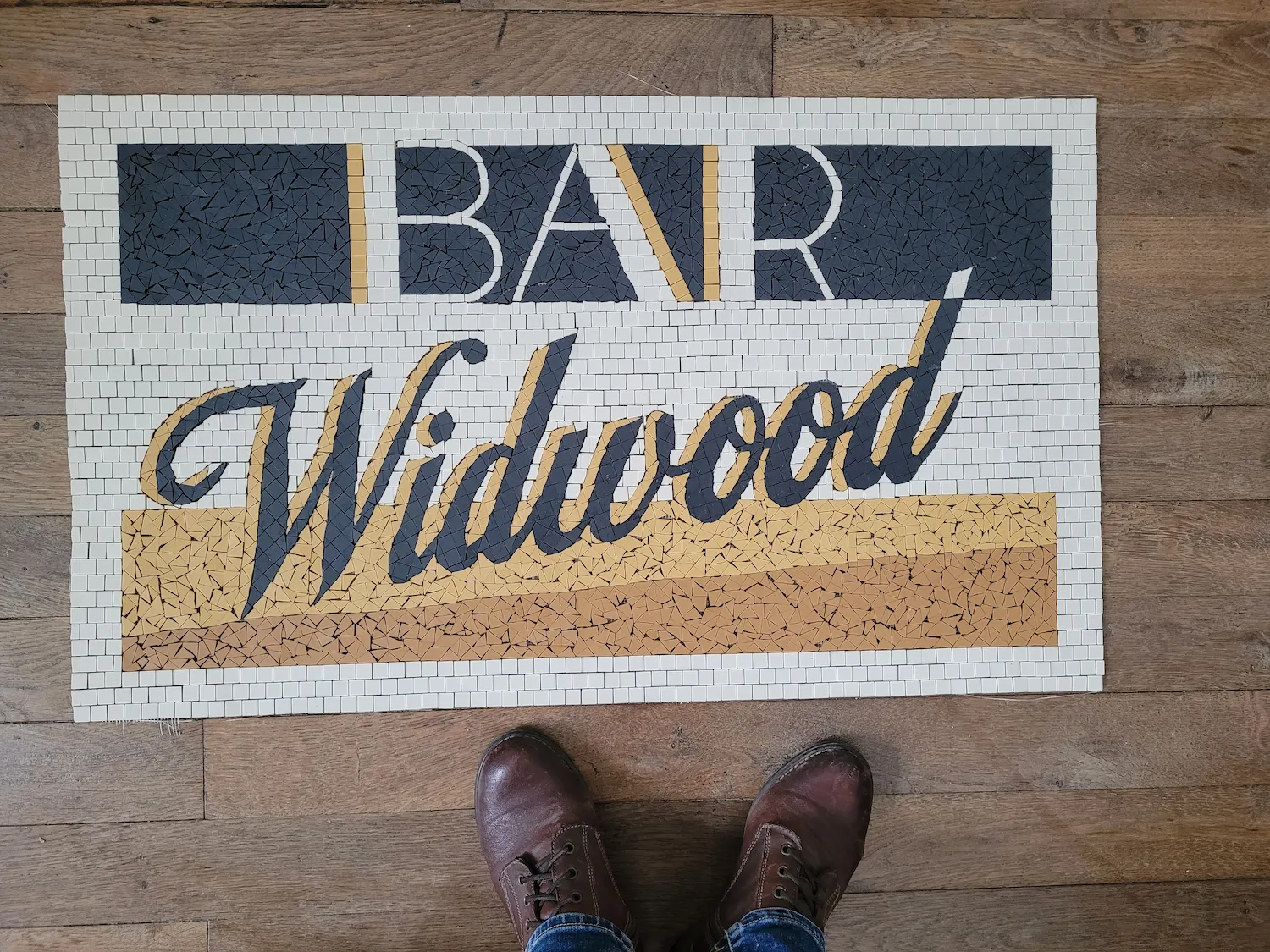 Tapis d'entrée du Bar Widwood