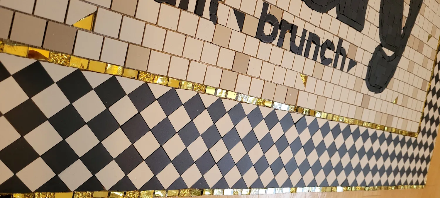 Zoom sur le tapis d'entrée du restaurant HANDY